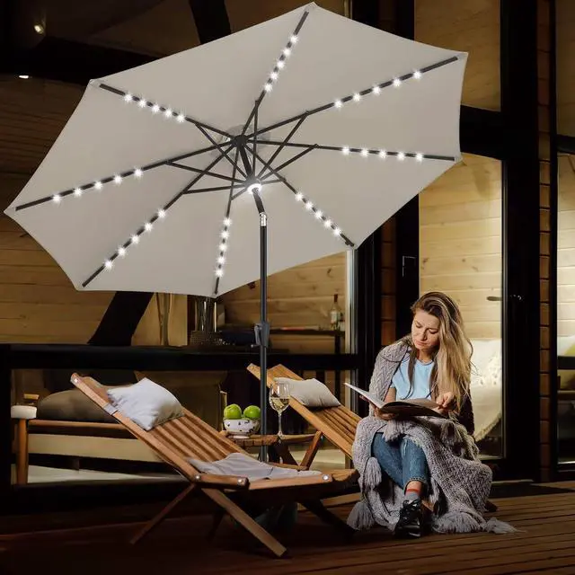 Alt view image 6 of 7 - FLAME&SHADE Solar Patio Umbrella with a Centre Light, 9 FT Taupe | 40 LED Lights, UV Protection, Waterproof, Porch Deck Outdoor Umbrella for Pool, Backyard, Garden, Provides Evening Lighting