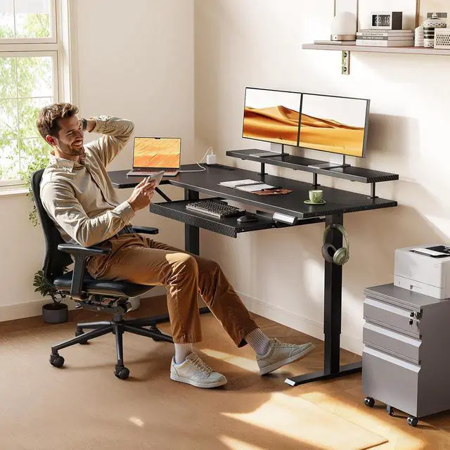 Alt view image 2 of 7 - 55 Inch L Shaped Electric Standing Desk with Keyboard Tray, Reversible Height Adjustable Corner Computer Desk with Monitor Stand, Sit Stand Up Lift Table for Home, Office, Carbon Fiber Black