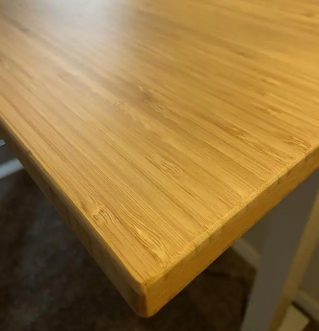 Alt view image 7 of 7 - Solid Bamboo Standing Desk, 48" x 24" Real Bamboo Desktop with Natural Grain, Durable & Sustainable Workstation for Home Office and Multi-Monitor Setups (White Oval Legs)
