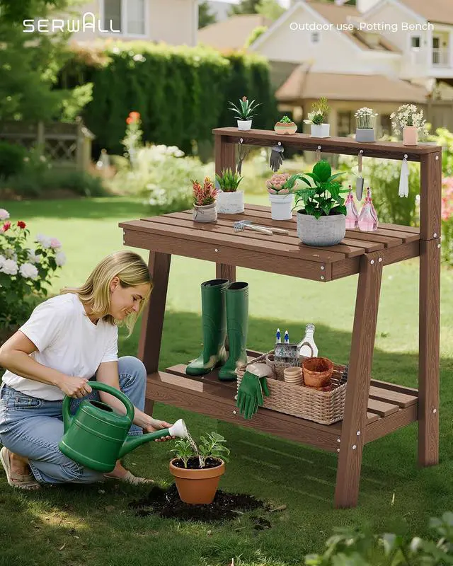 Alt view image 5 of 7 - Outdoor Potting Bench with Storage, 3-Tier HDPE Gardening Table with Angled Legs & Tool Hooks, All-Weather Use Heavy Duty Potting Table for Patio, Backyard, Garden, Brown