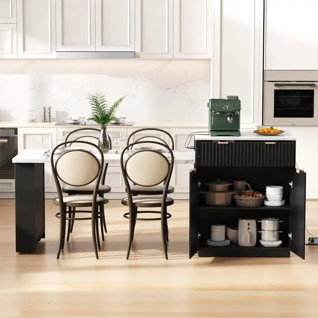 Alt view image 3 of 7 - Kitchen Island Solid Wood Food Prep Table w/Extendable Table,Fluted Cabinet &Faux Marble Top for Dining Room,Multi-functional Breakfast Bar Table w/USB,Sockets & Open Storage Shelves for 4-6 (Black)