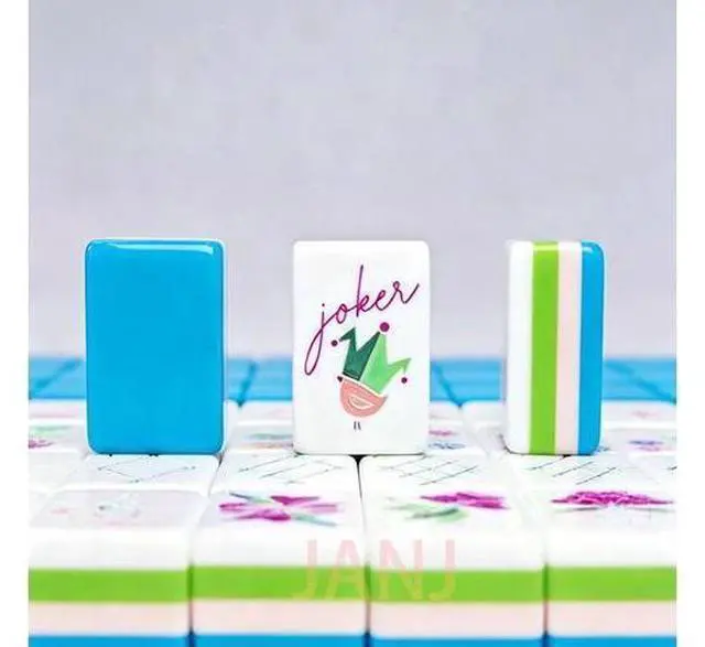 Main image of A mahjong player is playing mahjong with four layers of acrylic European-style mahjong leisure color-matched playing cards.