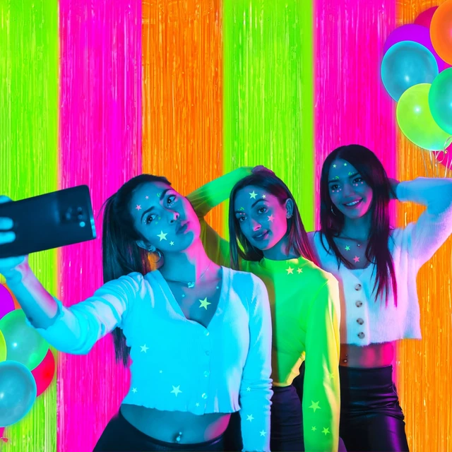 Alt view image 6 of 7 - Glow in The Dark Party Supplies 4 Pack Neon Party Decorations Foil Fringe Curtains 3.3x6.6 ft Fluorescent Green Pink Orange Tinsel Streamers Glow Backdrop Photo Props