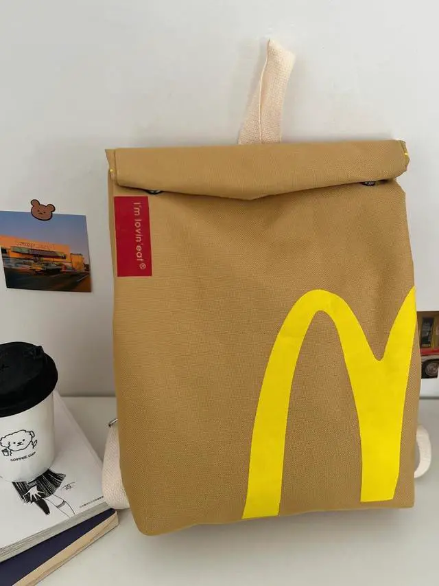 Alt view image 2 of 7 - Classic Funny Retro Paper Bag Large Capacity Backpack Cute Personalized Shoulder Crossbody Canvas Backpack Notebook