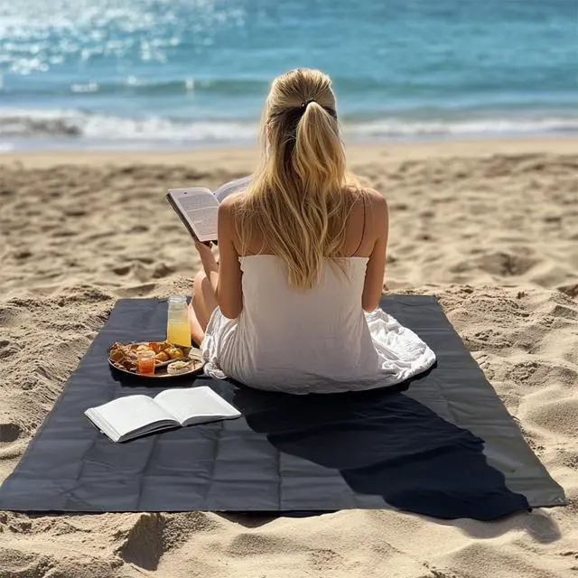 Alt view image 4 of 6 - Legnowit Outdoor Pocket Blanket, 55"x39" Waterproof Foldable Compact Small Picnic Blanket, Ultralight Tarp for Camping, Festival, Beach, Hiking, Backpacking, Travel, Stakes Included (Black)