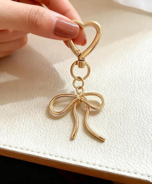 Alt view image 4 of 7 - Cute Bow Keychain Elegant Bow Bag Charm Heart Keychain for Women Keys Bag Purse Decor Friend Sister Family Gifts (Gold A)