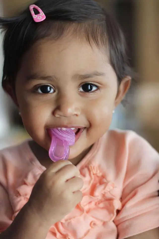 Alt view image 6 of 7 - Oral Care Babys First Toothbrush, Smooth Silicone Bristles Gently Clean Tender Teeth and Gums, for Ages 4+ Months, Clear, 1 Pack