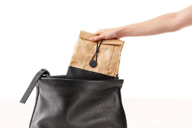 Alt view image 2 of 7 - Kraft To-Go Lunch Bag | Brown | 1 Gallon | Large Rolltop Reusable Meal Carrier with Room for Bottle & More | Kraft-Paper Style, Waterproof & Stain-Resistant, Insulated Lining