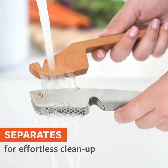 Alt view image 3 of 7 - No Mess Garlic Press - Easy-Clean Stainless Steel - Effortless Crushing and Quick Mess-Free Clean-Up - Integrated Cleaner Scraper, Dishwasher safe