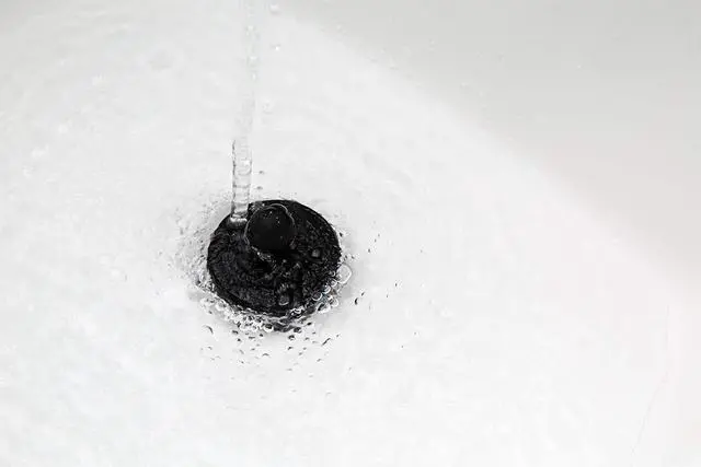 Main image of Universal Stopper for Bathtub and Bathroom Sink Drains, Black Plug 2pk, 2 Count