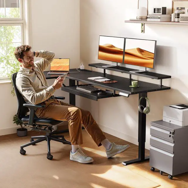 Alt view image 2 of 7 - 63" Reversible L Shaped Electric Standing Desk, Carbon Fiber Black | Monitor Stand, Keyboard Tray, Power Outlets, 3 Memory Presets, Corner Stand Up Desk for Ergonomic Home Office, Workstaion