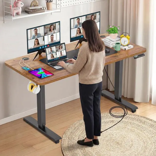 Alt view image 2 of 6 - 55 x 24inch Electric Standing Desk Adjustable Height with Power Outlets, Stand up Desk with Wheels,Outlets, Mouse Pad, Preset Heights Home Office Gaming Computer Workstations TableBrown