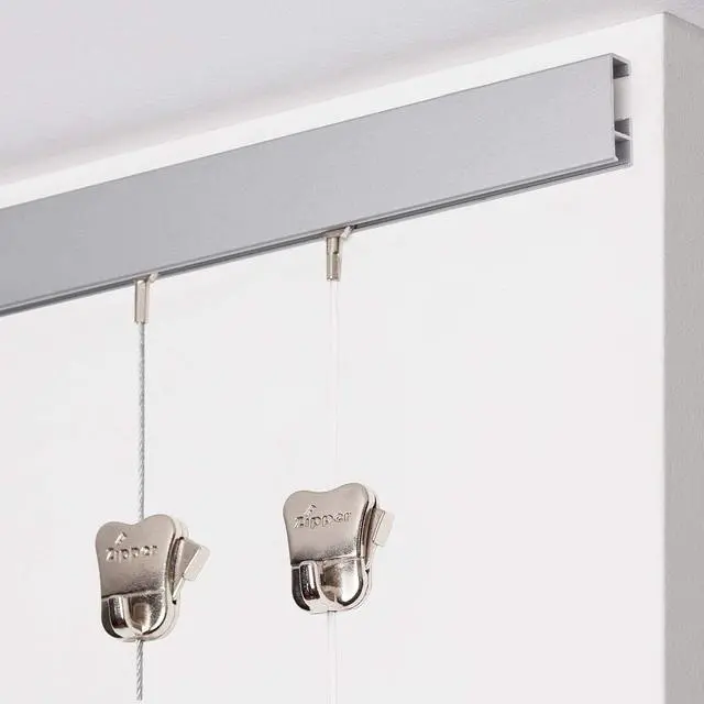Alt view image 2 of 6 - STAS Cliprail Picture Hanging System Set - Covers 19.69 ft of Wall Space - Basic Picture Rail & Art Hanging Gallery Kit (Matte Silver Rails, Includes 12 Hooks & 8 Cords)