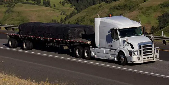 Alt view image 3 of 6 - 16' x 24' Flatbed Truck 18 Oz Steel Tarp with 4 FT Drop & Flap - Black Heavy Duty Vinyl Waterproof Tarp for Trailers to Protect Cargo from Wind, Rain, Snow and Sun