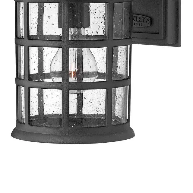 Alt view image 4 of 6 - Freeport Small Outdoor Wall Mount Lantern, New England Design, Cast Aluminum, Clear Seedy Glass, Black