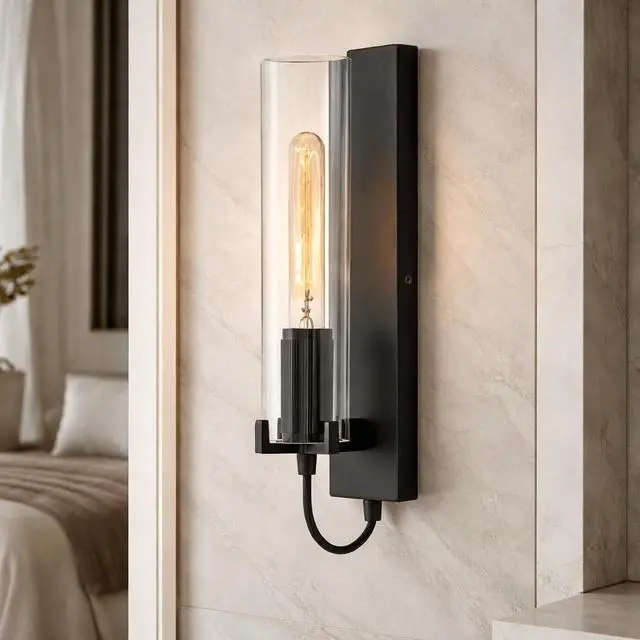 Alt view image 3 of 6 - Ryden Medium Indoor Single Light Wall Sconce, Black Finish | Clear Glass Cylinder Shade, Modern Industrial, Sleek, Includes Med. LED Bulb, Shown w/ T-Style Bulb, Hidden Mounting Hardware