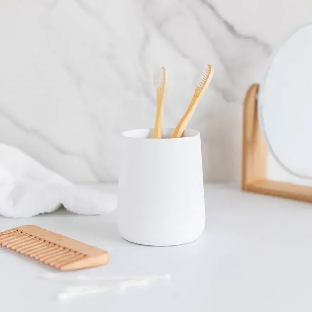 Alt view image 7 of 7 - Matte White Toothbrush and Toothpaste Holder and Cup for Bathroom Vanity and Countertop, Round Organizer for Electric Toothbrushes, Floss, Razors, Cotton, and Mouthwash