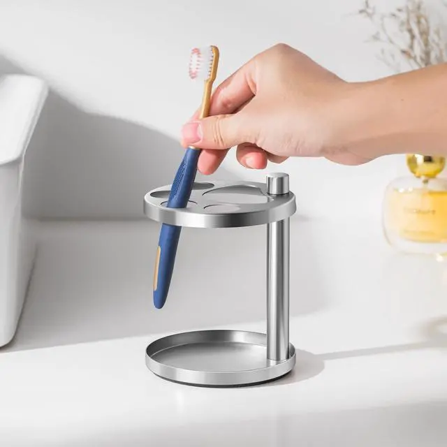 Alt view image 7 of 7 - Stainless Toothbrush Holder Stand for Bathroom: Stainless Steel Ventilated Organizer with Slots for Electric Toothbrushes, Toothpaste, Razors & Small Comb, Unique Footprint Base Design, Brushed Silver