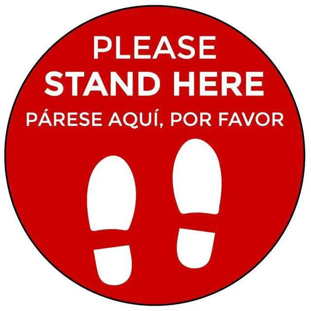 Main image of Social Distancing Floor Signs in English & Spanish - Pack of 25 Stickers - Red Stand Here Design - 12 Inch Circle - Indoor Only - Removable Adhesive Vinyl