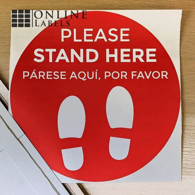 Alt view image 3 of 6 - Social Distancing Floor Signs in English & Spanish - Pack of 25 Stickers - Red Stand Here Design - 12 Inch Circle - Indoor Only - Removable Adhesive Vinyl