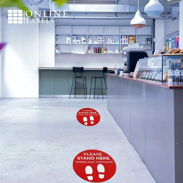Alt view image 4 of 6 - Social Distancing Floor Signs in English & Spanish - Pack of 25 Stickers - Red Stand Here Design - 12 Inch Circle - Indoor Only - Removable Adhesive Vinyl