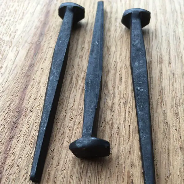 Alt view image 2 of 6 - 3- Wrought Head Iron Nails Antique Black rustic restoration accent nails for hanging, furniture, cabins, shutters & flooring Decorative clavos nails Distinct wrought rose head 3 in
