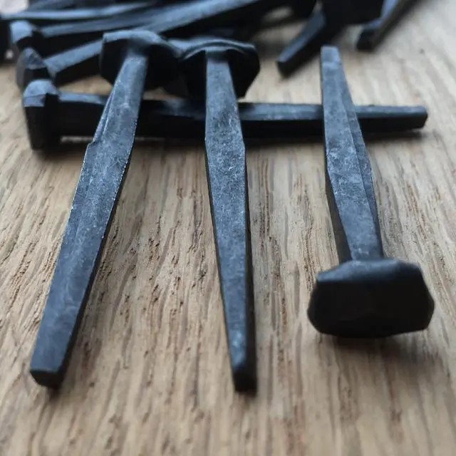 Alt view image 6 of 6 - 3- Wrought Head Iron Nails Antique Black rustic restoration accent nails for hanging, furniture, cabins, shutters & flooring Decorative clavos nails Distinct wrought rose head 3 in