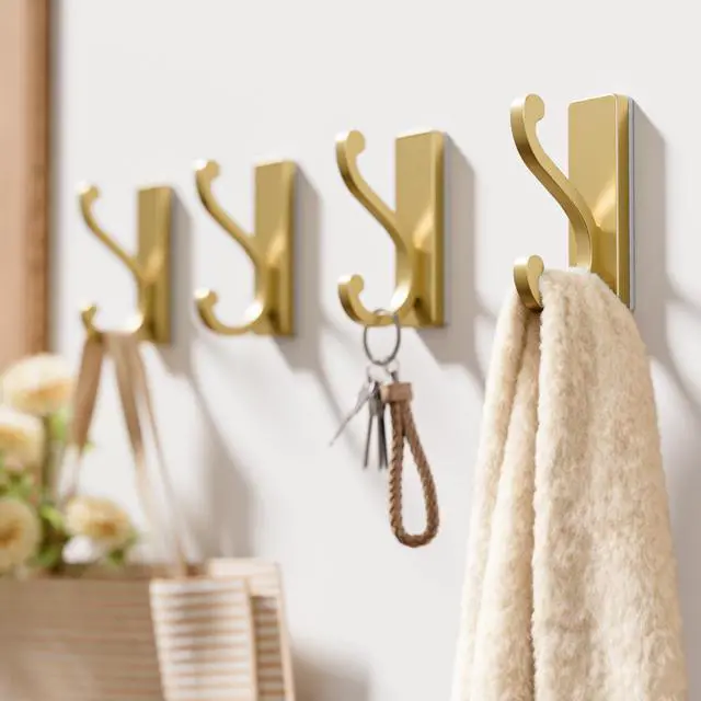 Alt view image 2 of 7 - 4 Pack Self Adhesive Coat Hooks - Gold Sticky Hangers Wall Mount, Holds 13Lbs for Clothes, Towel, Robes, Keys, Double Hooks for Bathroom, Bedroom and Door.