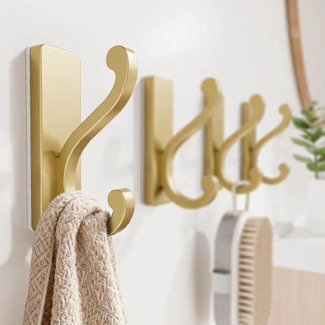 Alt view image 7 of 7 - 4 Pack Self Adhesive Coat Hooks - Gold Sticky Hangers Wall Mount, Holds 13Lbs for Clothes, Towel, Robes, Keys, Double Hooks for Bathroom, Bedroom and Door.