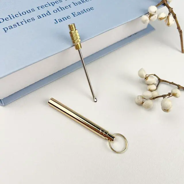 Alt view image 7 of 7 - Folding Brass Ear Wax Removal Tool - Portable Ear Pick Cleaner with Key Ring