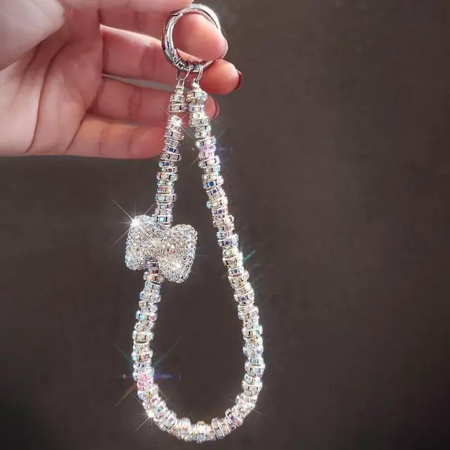 Alt view image 7 of 7 - Luxury Diamond Phone Wrist Strap Phone Lanyard With Phone Tether Tab, Shiny Rhinestone Phone Chain Phone Charm Phone Strap Wrist Lanyard for Keys Bow keychain Wristlet Cell Phone Lanyards for Women