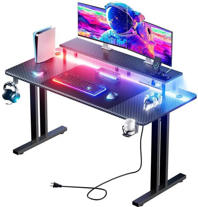 Main image of 63 Inch Gaming Desk with LED Lights & Cable Management, Black | Ergonomic carbon fiber gaming computer desk with 5 sockets, monitor stand, cup holder, headphone hook & mouse pad for gamers