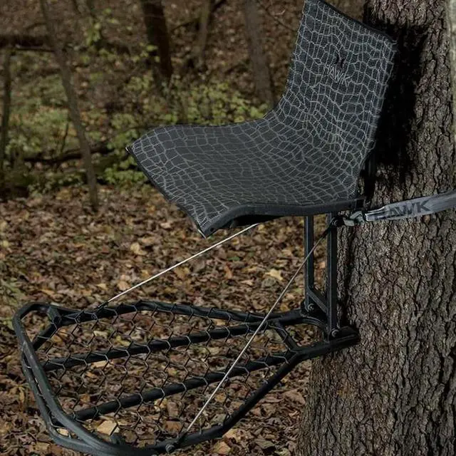 Alt view image 7 of 7 - Kickback Lvl Hang on Tree Stand HWK HF2031, 24x30 Platform | 24x30 in Welded Platform, Xl Mesh Seat 21x15 in, Steel Construction, 300 Lb Capacity, Kickback Footrest