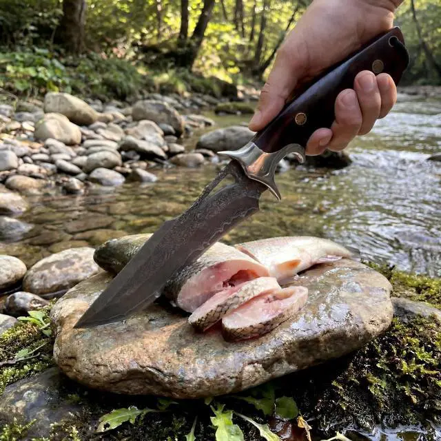 Alt view image 7 of 7 - Damascus Hunting Knife 10.4" Fixed Blade VG10 Leather Sheath | 107-layer hand-forged bowie construction with ergonomic rosewood handle for outdoor camping and survival