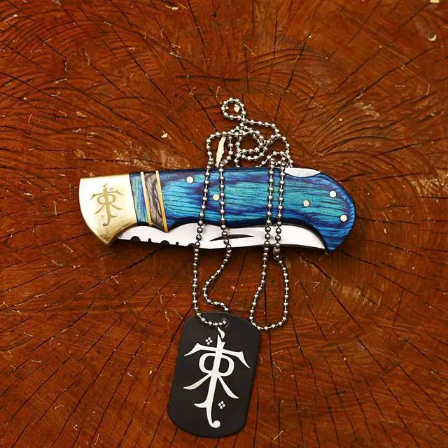 Alt view image 6 of 6 - Hundex 3.25" Folding Pocket Knife, 420HC Blade, Pakka Wood Handle, Brass Lord of the Rings Symbol, EDC Tactical Knife with Gift Locket, Ideal for Camping, Survival, and Gifts (Blue sheath)