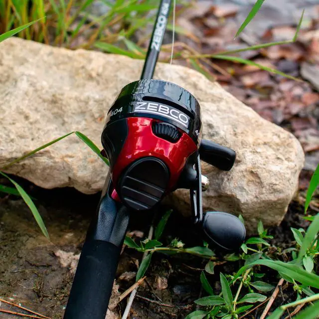 Alt view image 7 of 7 - 404 Spincast Reel and Fishing Rod Combo, 6-Foot 2-Piece Fishing Pole, Size 40 Reel, Right-Hand Retrieve, Pre-Spooled with 15-Pound Line, Black/Red