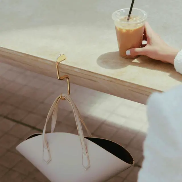 Alt view image 4 of 7 - FLIP Bag Hook - Newly Redesigned. Portable Purse Hanger for Table with Magnetic Closure - Now Holds up to 50 lbs (Gold)