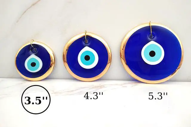 Alt view image 2 of 6 - 3.5" Glass Blue Evil Eye Wall Hanging Gold Ornament - Turkish Nazar Bead - Home Protection Charm - Gold Wall Decor Amulet in a Box (Medium)