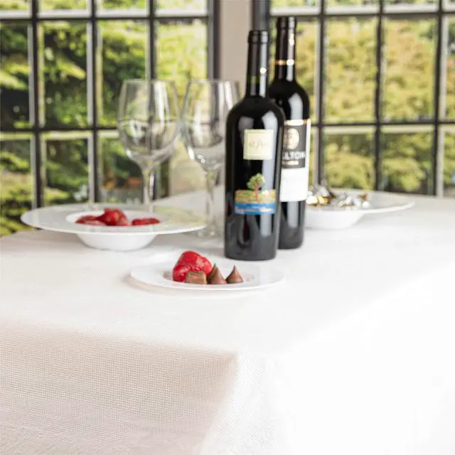 Alt view image 4 of 6 - Disposable 3 Ply Paper & Plastic Tablecloth Absorbent, Waterproof, White Table Cover for Rectangle Tables fits 6-8 Foot Tables Size: 54'' X 108'' Pack of 5