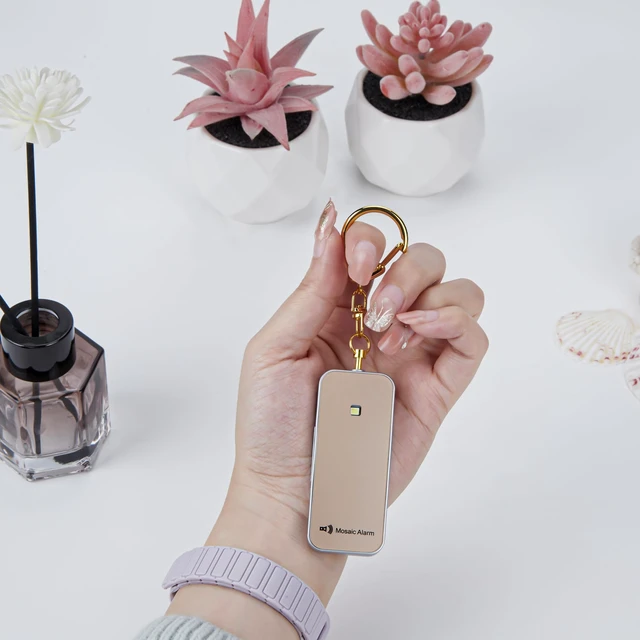 Alt view image 7 of 7 - Ultrathin Personal Alarm Waterproof Replaceable Battery Strobe Light Ultra-Lightweight 0.8 oz Bulky-Free Keychain SOS Siren Women Student Safety. Emergency 130db Rainproof Hiking Alert. Gold