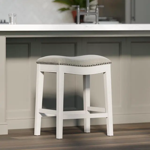 Alt view image 2 of 7 - 26in. Counter-Height Backless Wood Saddle-Seat Barstool with Nailhead Trim, Farmhouse Whitewash with Gray Upholstered Seat, 1PC
