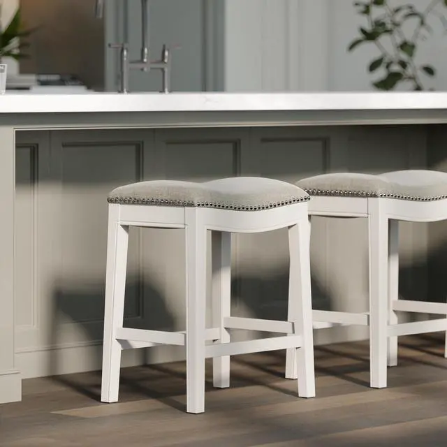Alt view image 6 of 7 - 26in. Counter-Height Backless Wood Saddle-Seat Barstool with Nailhead Trim, Farmhouse Whitewash with Gray Upholstered Seat, 1PC
