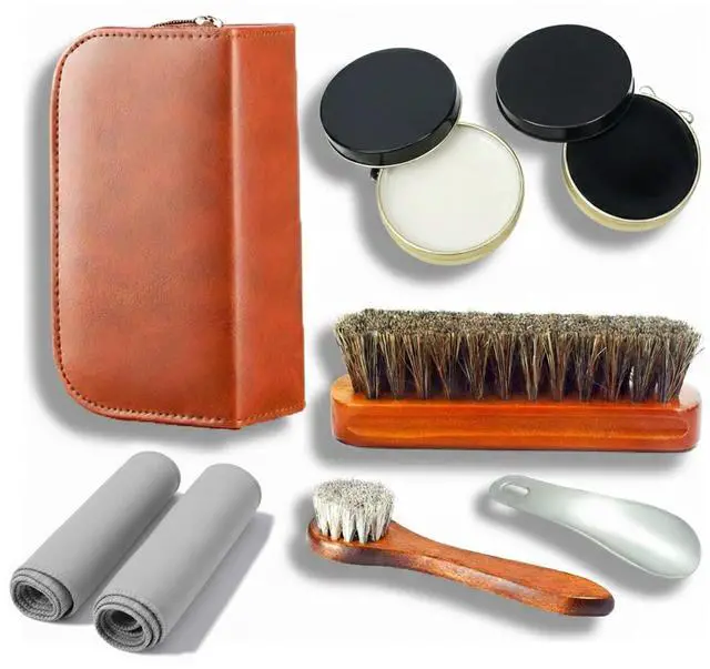 Main image of Shoe Care Kit,includes a Medium Horsehair Shoe Brush, a Long-Handled Round Brush, White Shoe Polish, a Black Shoe Polish, a Polishing Cloth, a Shoe Horn, and a Storage Box.