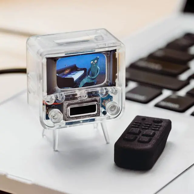 Alt view image 7 of 8 - TinyTV 2 Portable Retro Mini TV 1.14 IPS Screen, Preloaded & Uploadable Videos, USB-C Rechargeable, Knob Controls + Tiny Remote (Clear)