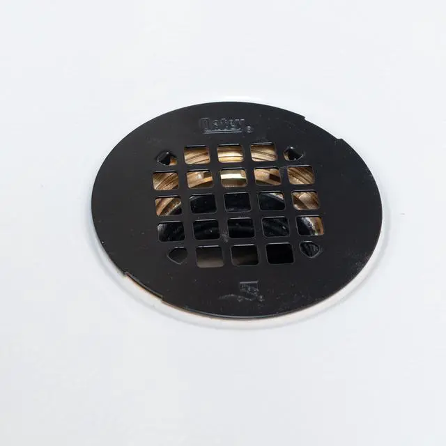 Alt view image 2 of 7 - Universal 4-1/4 in. Round Snap-Tite Shower Strainer, Matte Black