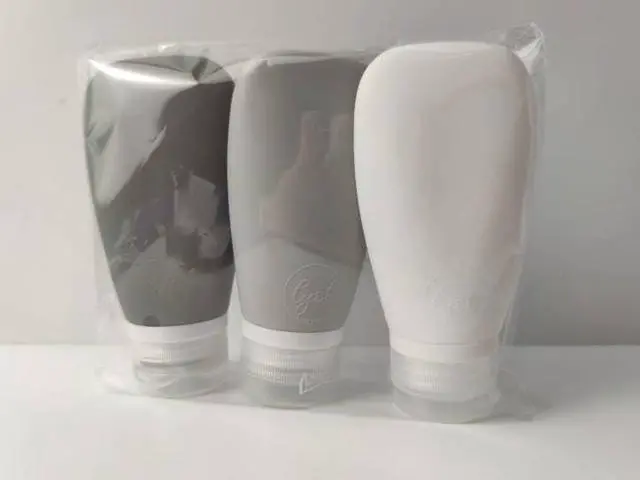 Alt view image 3 of 7 - Travel Bottles for Toiletries, TSA Approved 3oz (90ml) Leak Proof Silicone Refillable Squeeze Travel Size Containers BPA Free for Cleansers, Lotions, Shampoo 3-pk (Black-Gray-White)
