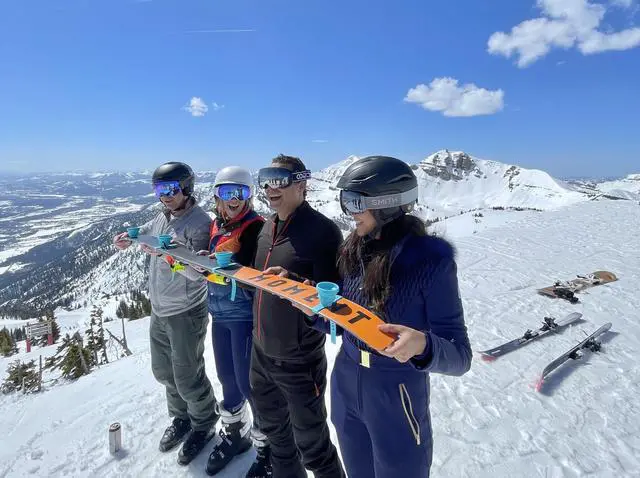 Alt view image 2 of 7 - Collapsible and Portable Shot Ski Kit - 4-pack w/ carrying pack. Silicone cups with an adjustable strap that turn any object into a "shot ski"