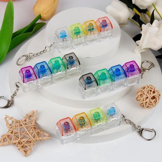 Alt view image 6 of 6 - 4 PCS Keyboard Fidget Toy, Keyboard Fidget Keychain 4-in-1 Keyboard Decompression Button Finger Clicker Toys, Button Stress Relief Fidget Gifts (Transparent Colorful)