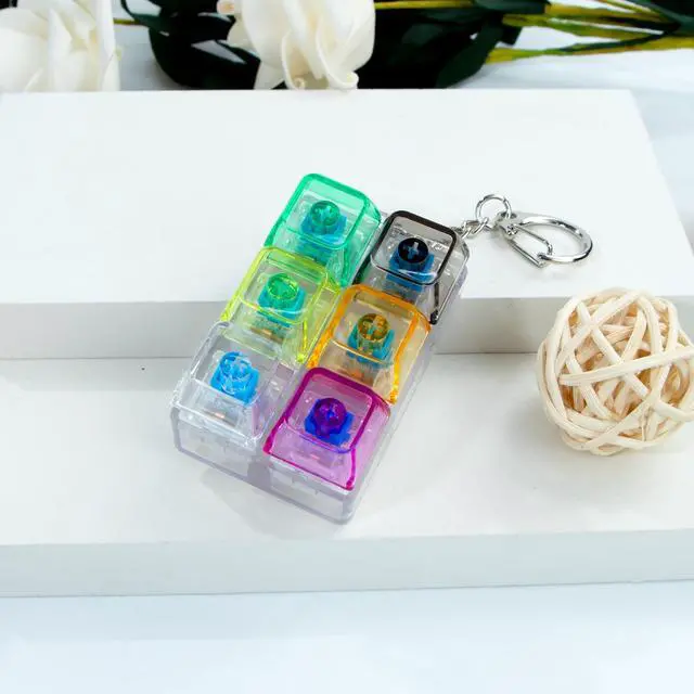 Alt view image 2 of 7 - 6-in-1 Keyboard Fidget Toy Keychain, Mini Finger Clicker Sensory Fidget Buttons, Pocket Stress and Anxiety Relief Sensory Toy, Focus Fidget Gift for Adults Office Travel (Transparent Colors