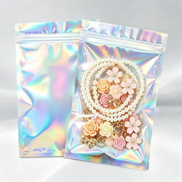 Main image of 100Pcs Holographic Resealable Mylar Bags, 3x5 In Smell Proof Packaging Bag | Foil Pouch,Resealable Bags for Small Business, Goodie Baggies for Treat, Jewelry, Party Favors, Candy, Christmas Gift Bags